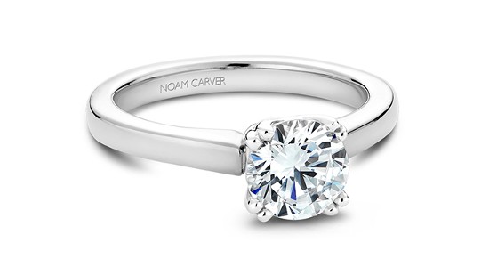 a silver solitaire engagement ring with a round cut diamond from Noam Carver