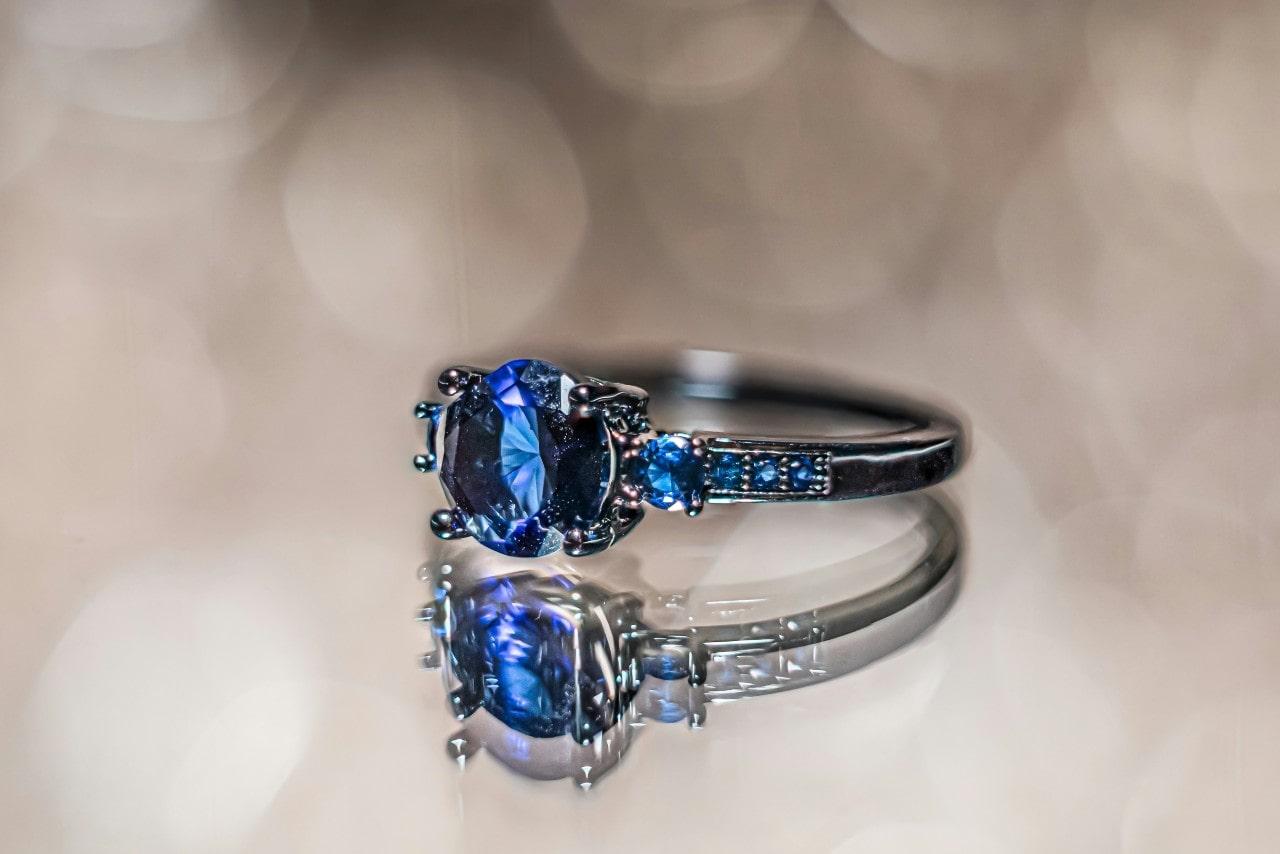 An elegant sapphire engagement ring with sapphire side stones. An elegant sapphire engagement ring with sapphire side stones.