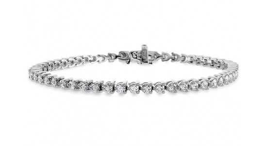 a diamond tennis bracelet in a silver setting