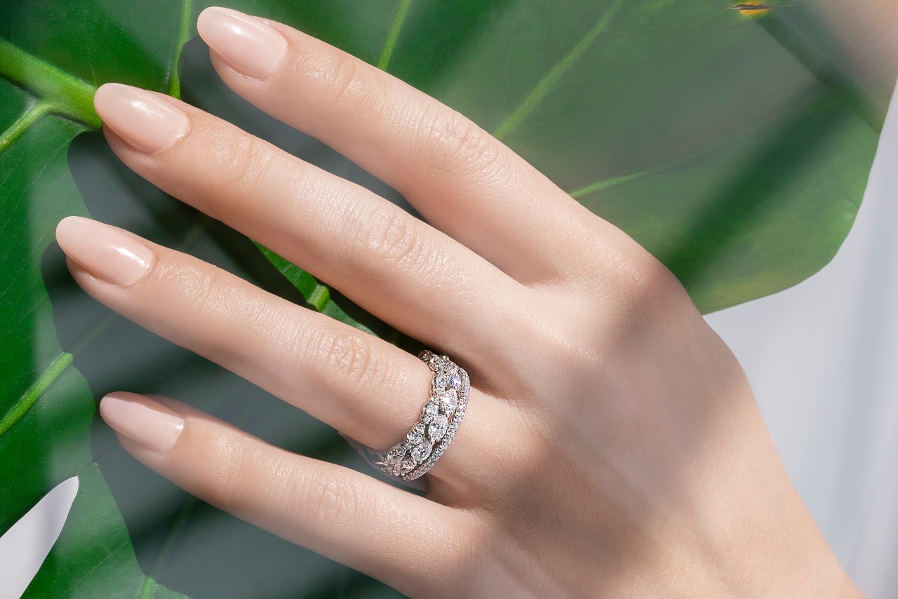 a lady’s hand wearing a TACORI platinum wedding band